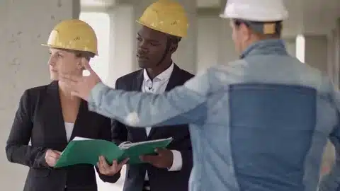 two people discussing a project and issue about construction with construction hats